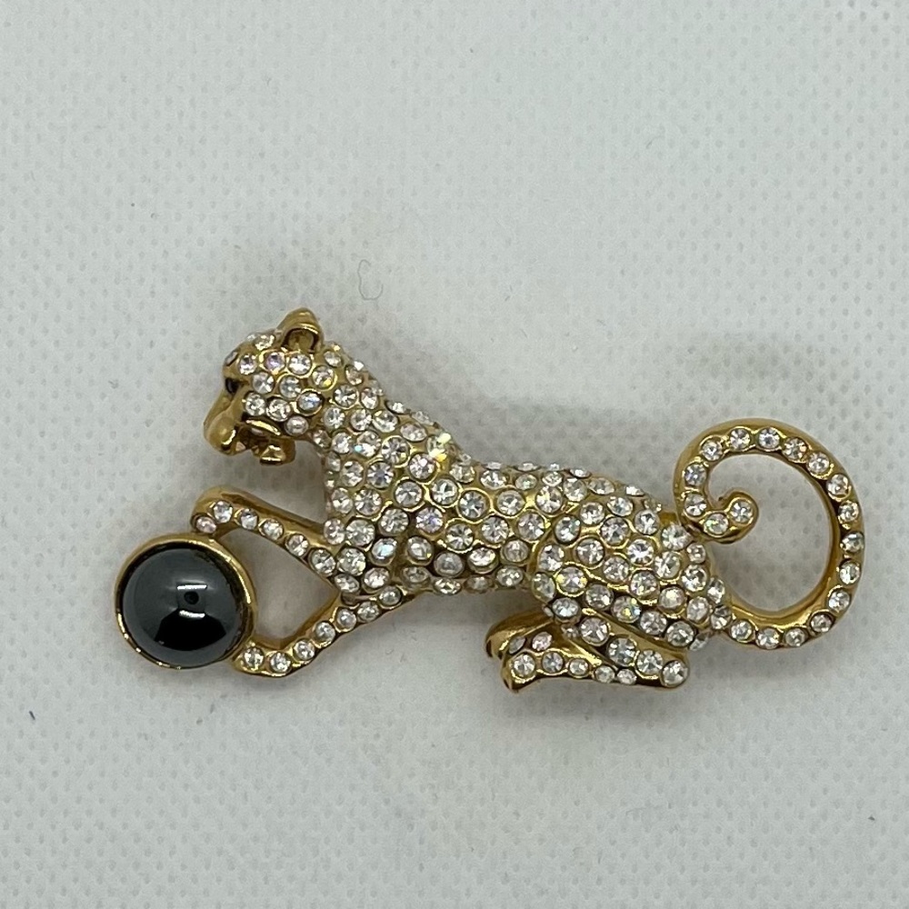 “Leopard” cat with ball brooch